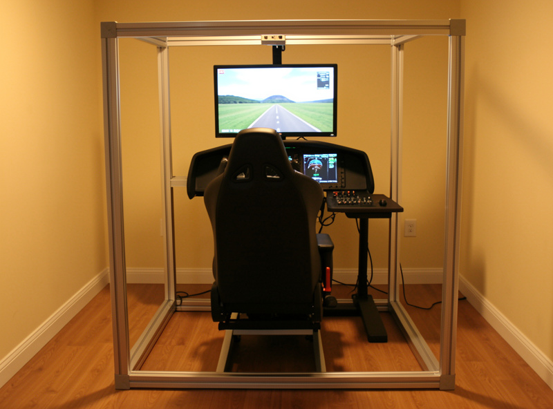 Home flight sim cockpit seat in an aluminium profile rig with the monitor at horizon eyeline height